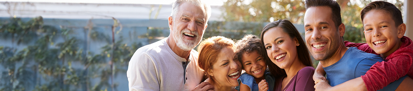 Family smiling outdoors